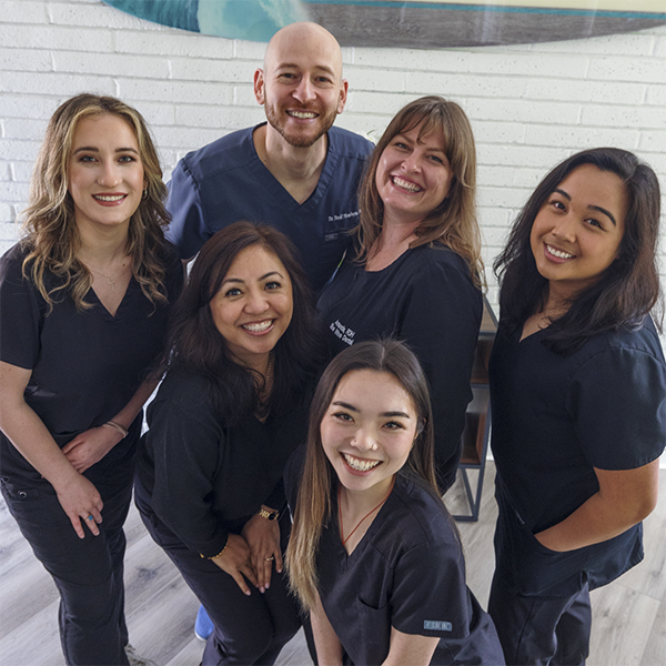 The smiling dentist and staff members at Blue Wave Dental of Walnut Creek