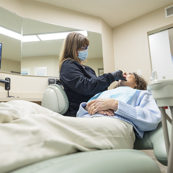 Dentist examining a patient's mouth