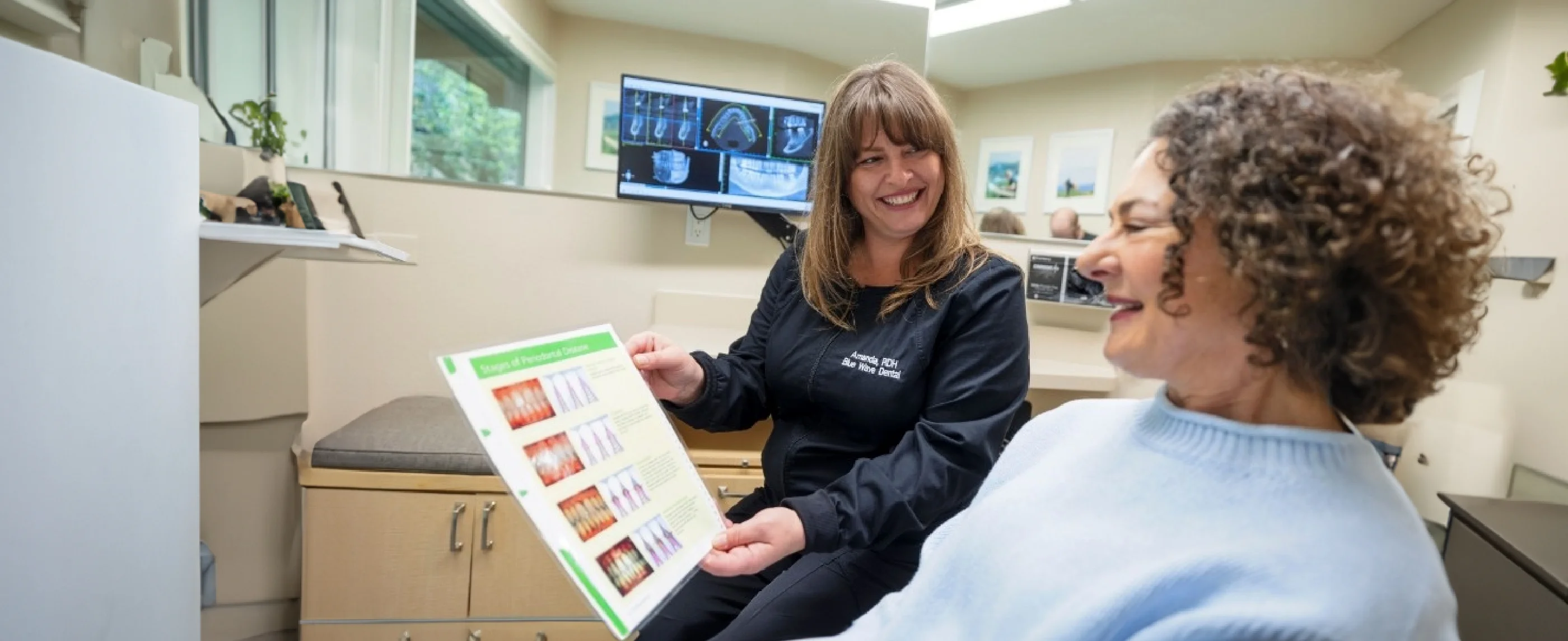 Walnut Creek dental team member showing images of teeth to patient