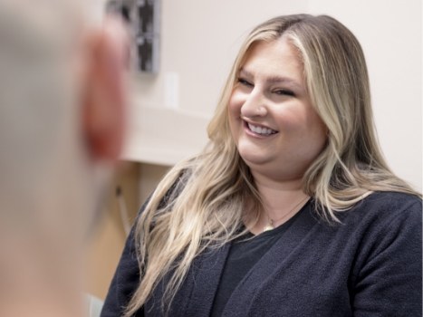 Blonde woman at dental office smiling