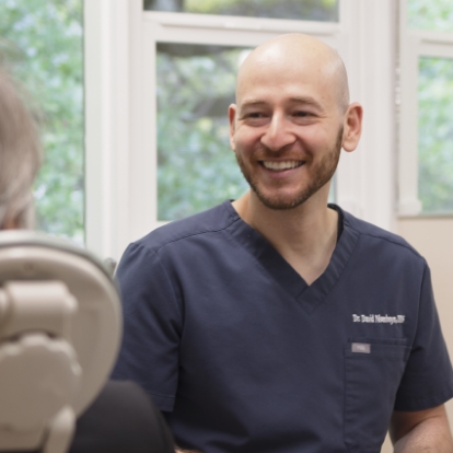 Doctor David smiling at a dental patient