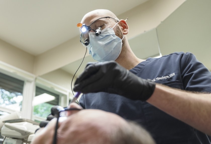 Dr David working on a patients mouth