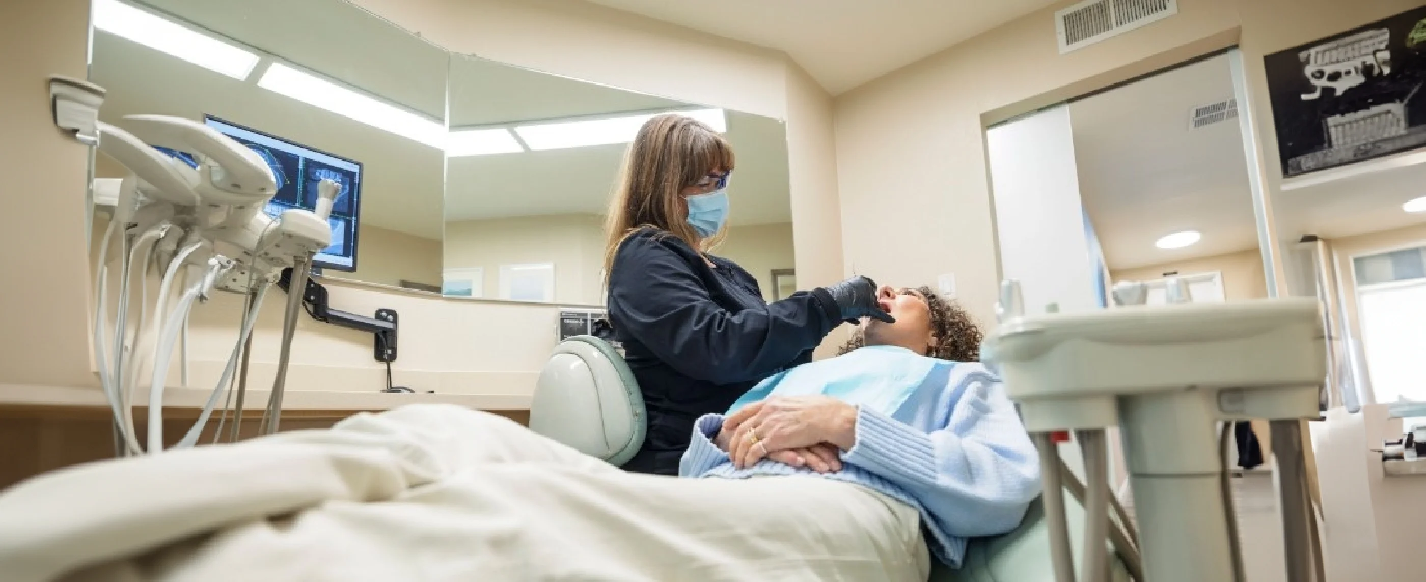 Dental team member performing a tooth extraction in Walnut Creek