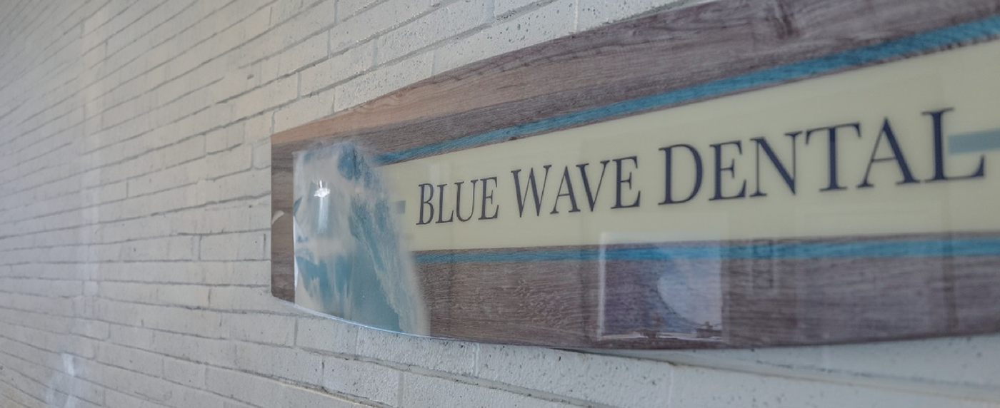 Sign for Blue Wave Dental in window