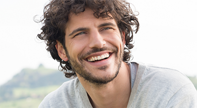 Young man with curly brown hair