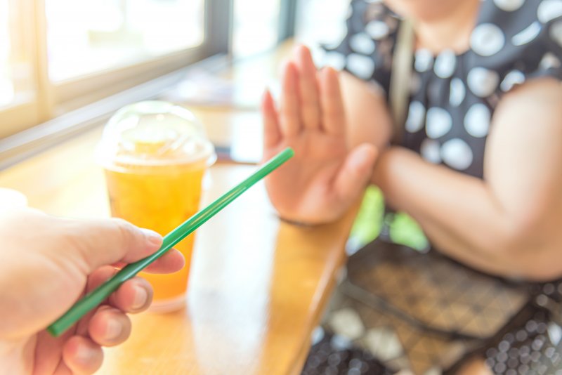 Woman declining a straw